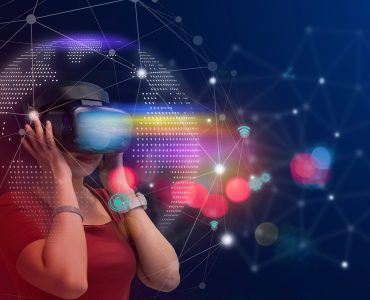 Young girl play VR virtual reality goggle and experiences of metaverse virtual world on colorful. Visualization and simulation, 3D, AR, VR, Innovation of futuristic, Metaverse Technology concepts.