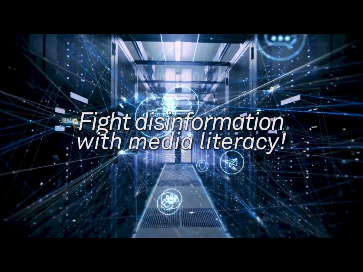 Text: Fight disinformation with media literacy! over a server room with glowing blue lines and icons.