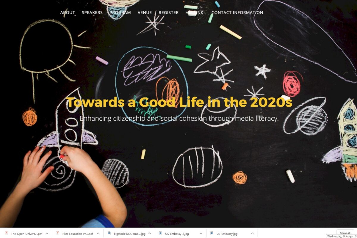 Child's hands drawing a rocket on a blackboard with the text: Towards a Good Life in the 2020s