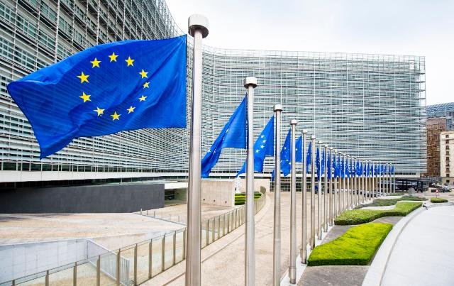 European Union flags flying in front of the European Commission building in Brussels