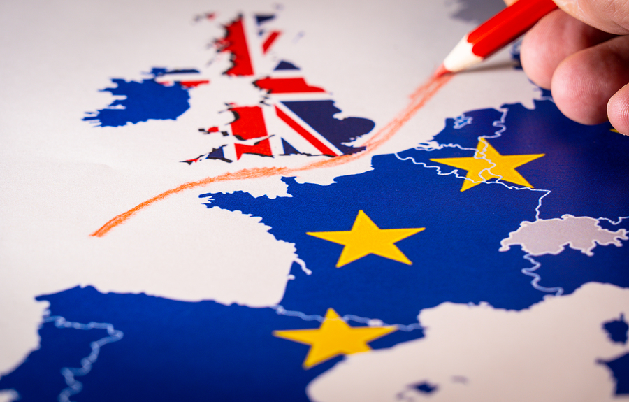 A red pencil drawing a line between the UK, depicted with the Union Jack, and mainland Europe, with EU stars.