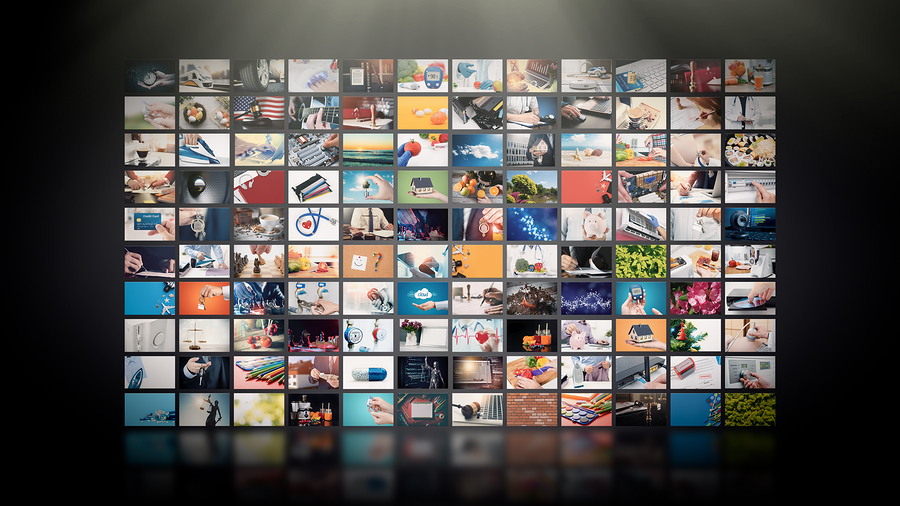 A large grid of small video screens, each showing a different image, suggesting diverse media content.