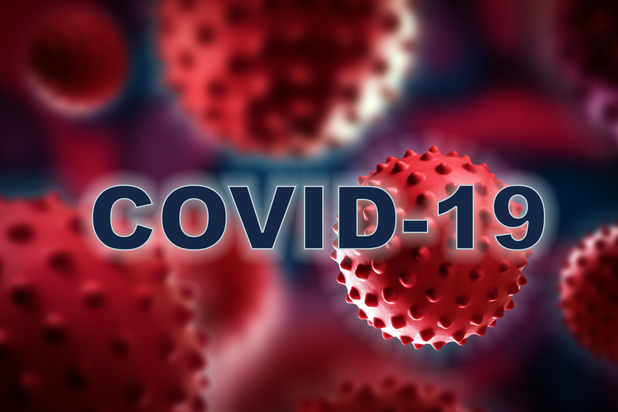 The text COVID-19 in white with a blue outline, superimposed on a background of red virus cells.