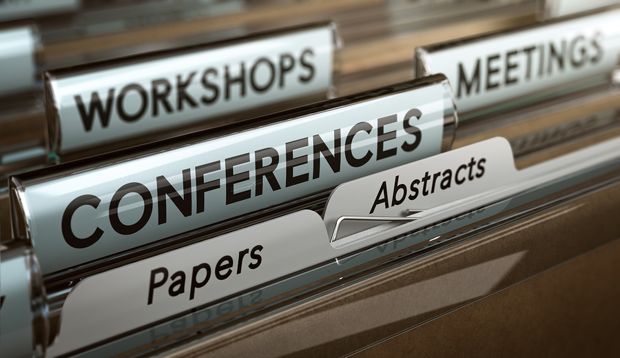 Close-up of file folders in a drawer, with visible labels: Workshops, Meetings, Conferences, Papers, Abstracts.