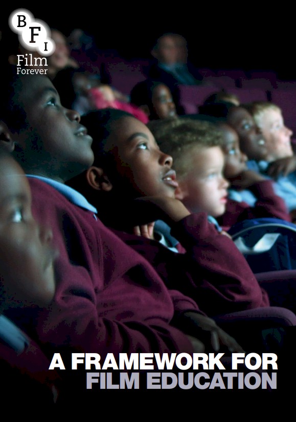 Children in school uniform looking up intently in a dark cinema, with the text A FRAMEWORK FOR FILM EDUCATION