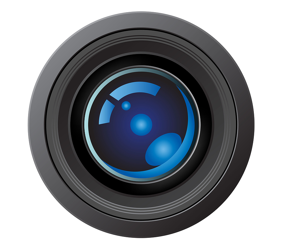 A camera lens with a dark blue centre and light blue reflections, set against a white background.
