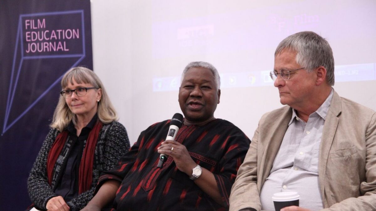 Three speakers, two men and one woman, sitting on a panel at the Scottish International Film Education Conference.