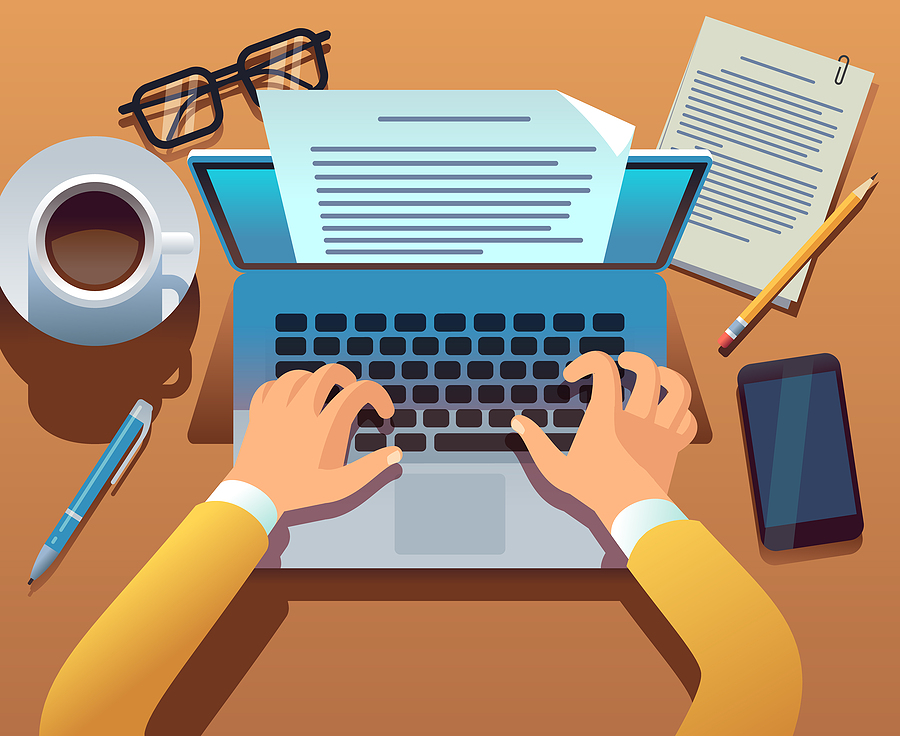 Overhead view of a person typing on a laptop, with a coffee cup, glasses, pen, paper, and phone nearby.