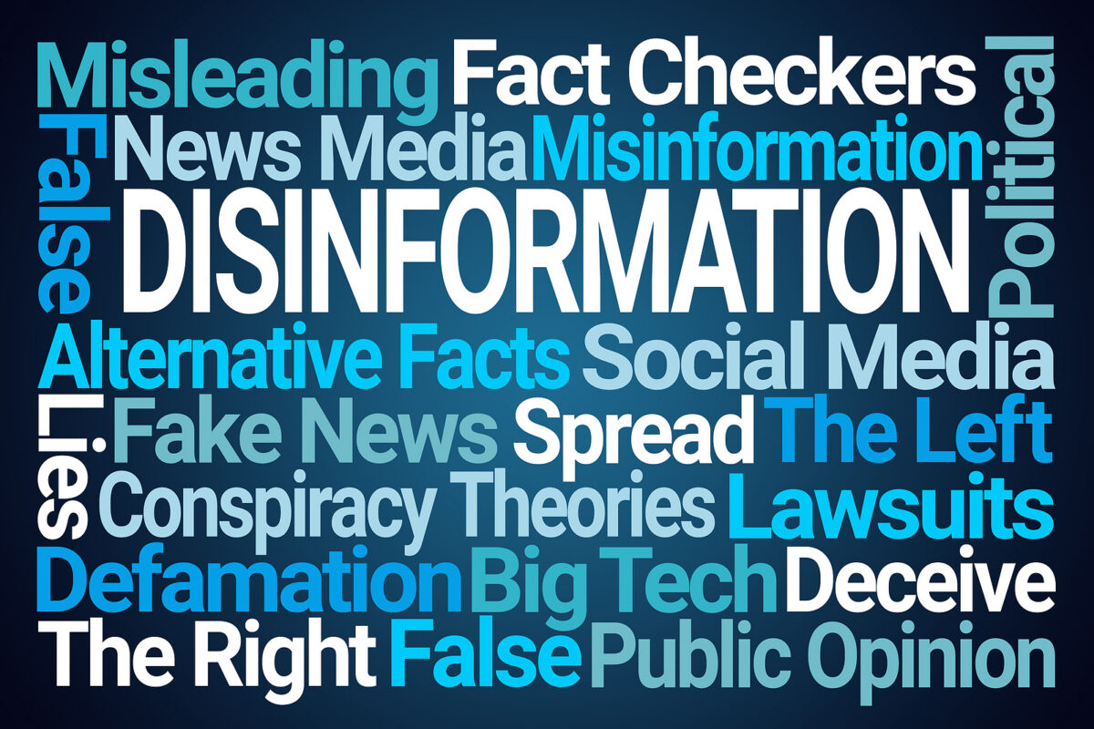 Word cloud with 'DISINFORMATION' in large white letters, surrounded by related terms in blue.