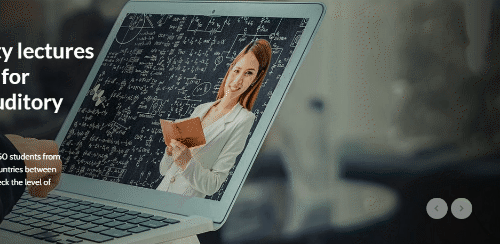 A laptop screen showing a smiling woman holding a book in front of a blackboard with equations