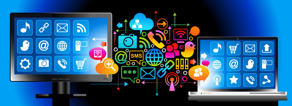 A monitor and a laptop displaying app icons, connected by a network of colourful social media icons.