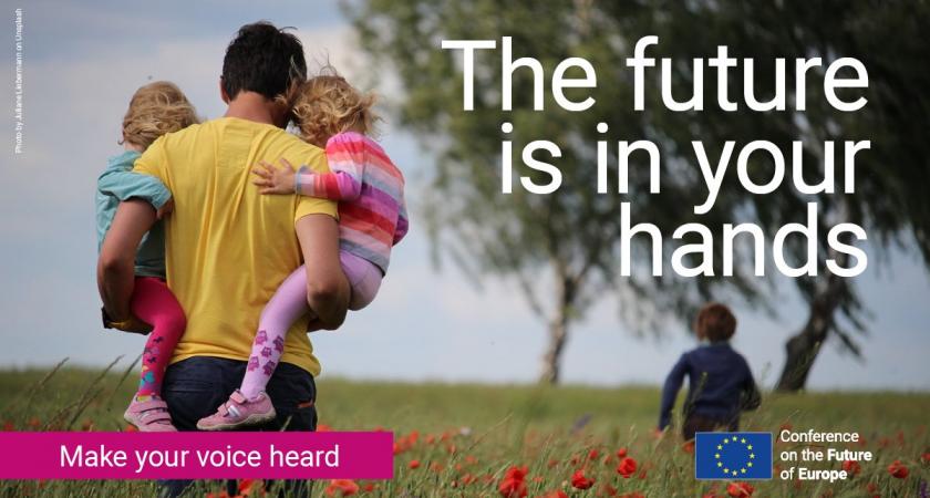 A man carries two young children in a field of red flowers, with text: The future is in your hands. Make your voice heard.