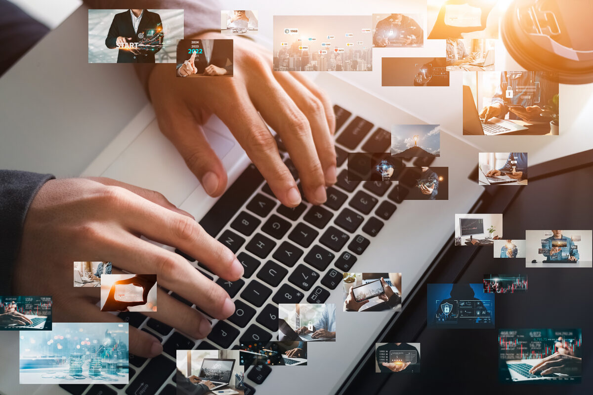 Hands typing on a laptop keyboard, surrounded by a collage of small images related to technology and business.