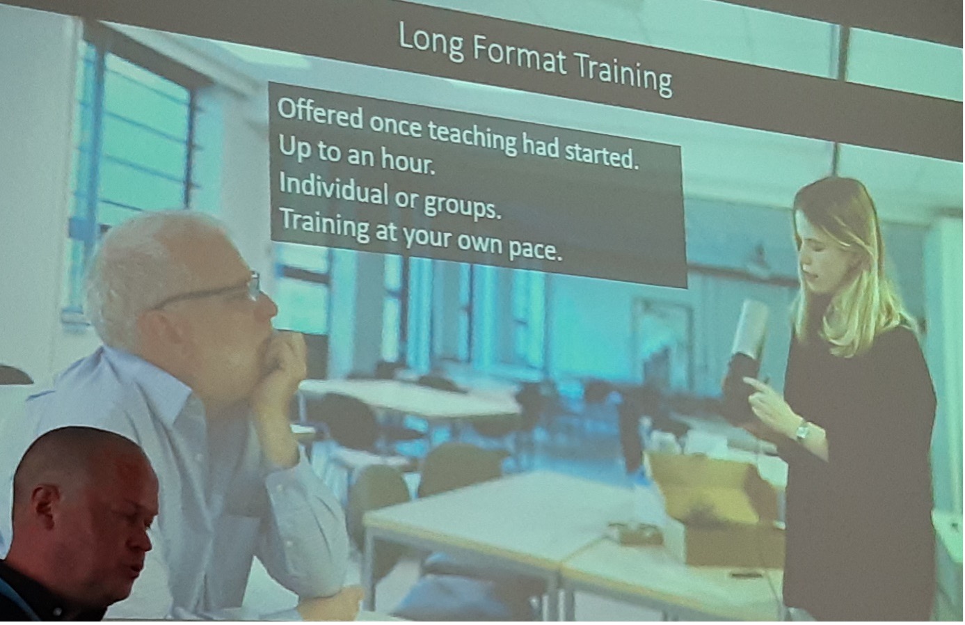 Stuart Phillipson in front of the screen presenting at Media & Learning conference
