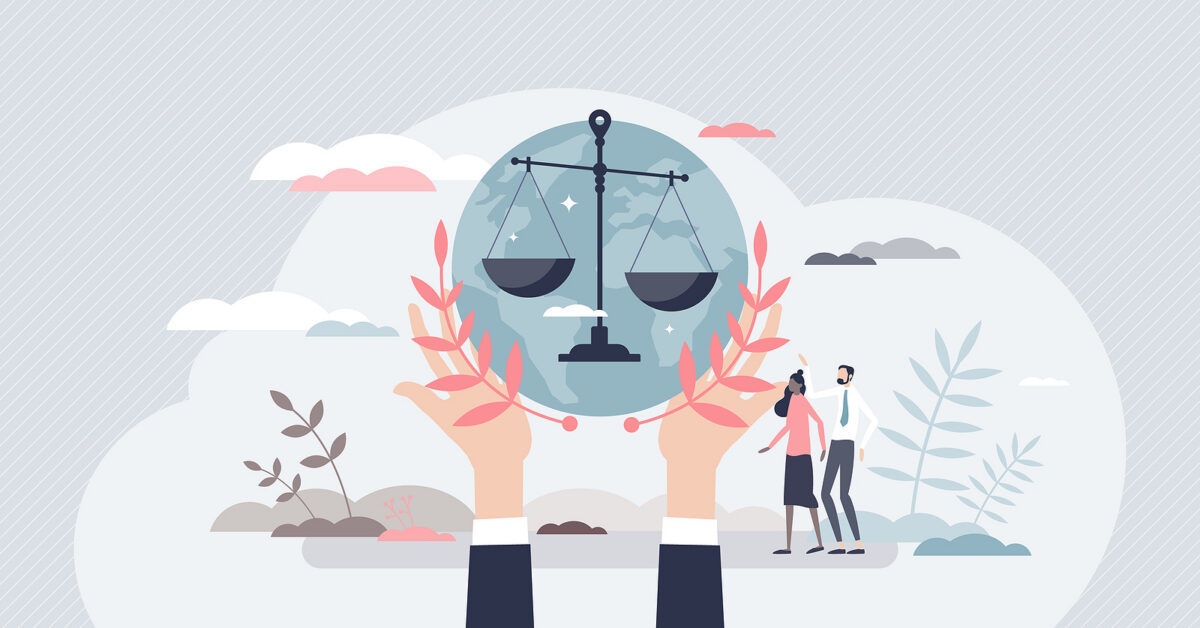 Hands holding a globe with a justice scale and olive branches, with two people standing nearby.