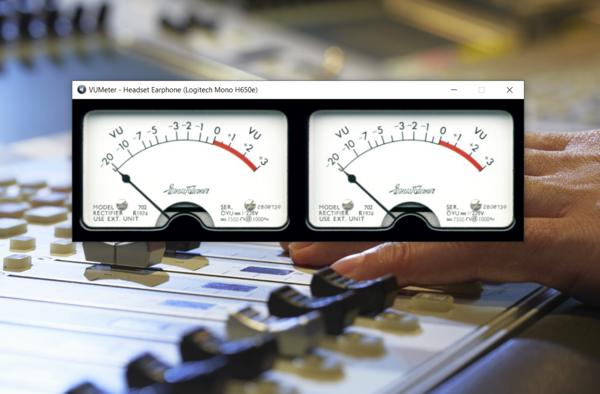 A screenshot of a VU Meter application showing two analogue VU meters, overlaid on a sound mixing desk.