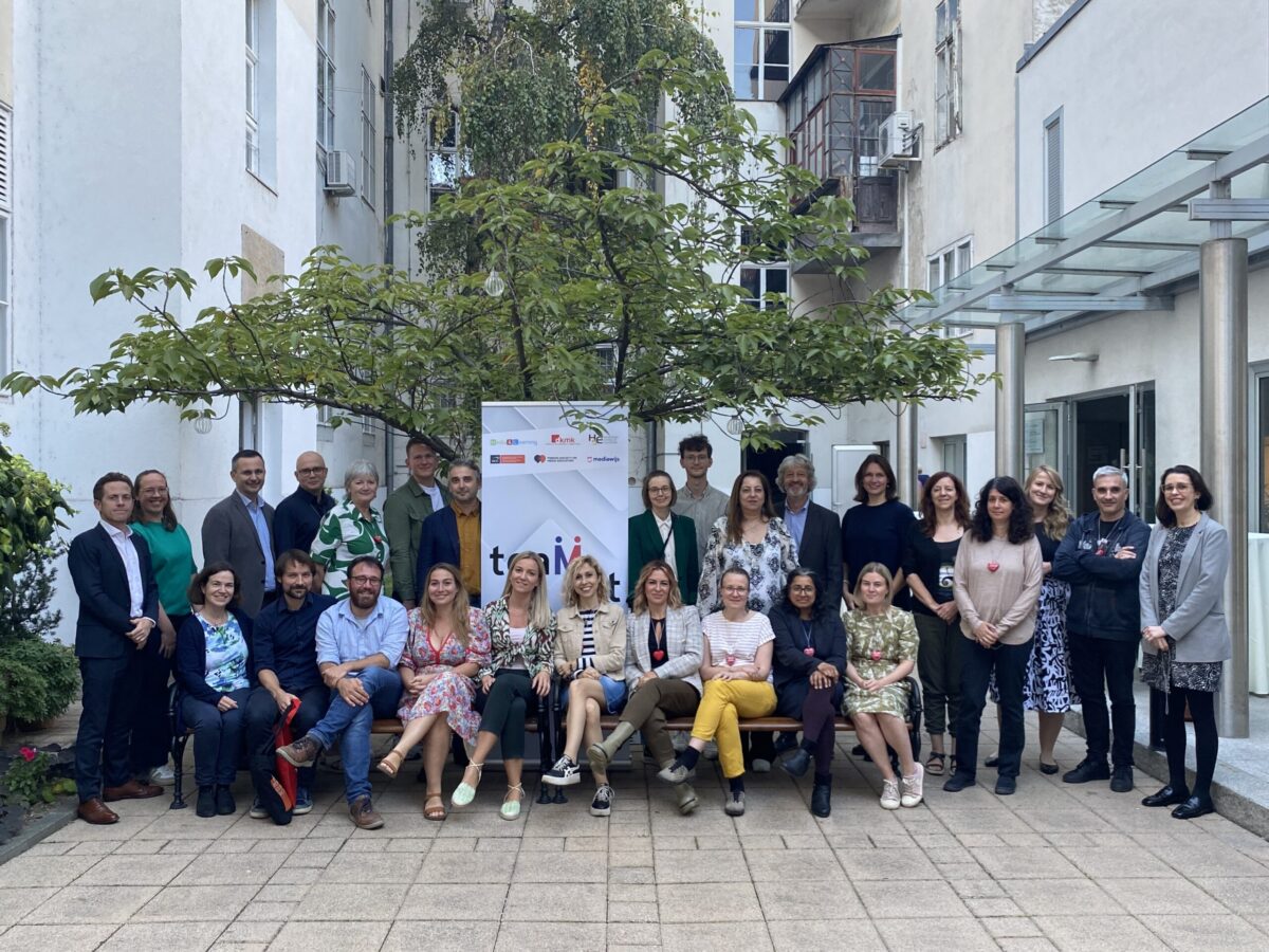Group photo of TeaMLit partners and advisory board members in Zagreb, some seated on a bench, others standing.