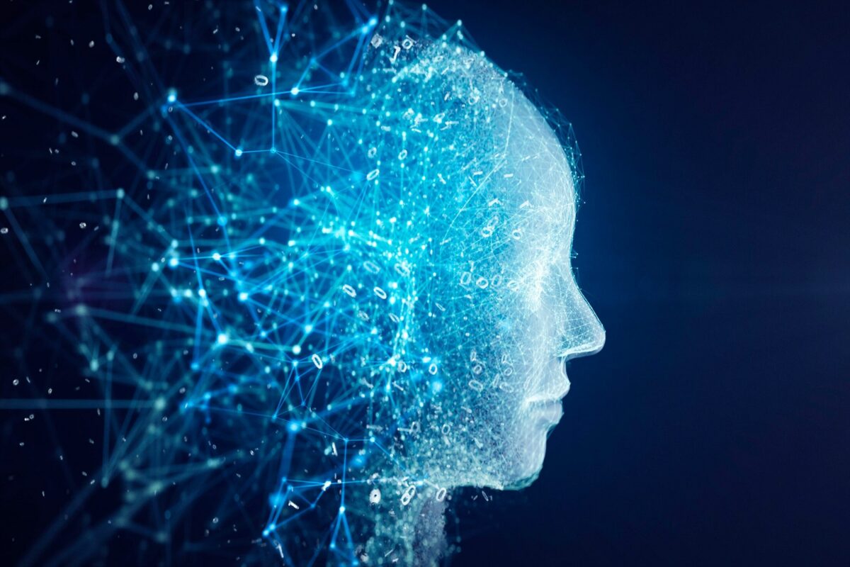 A glowing, blue, wireframe profile of a human head, with data points and connections extending from it.