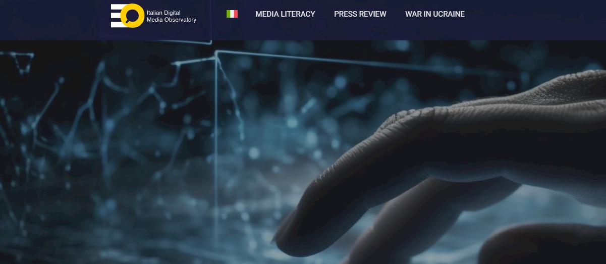 IDMO logo and website navigation bar with Media Literacy, Press Review, War in Ukraine, over a hand touching a digital