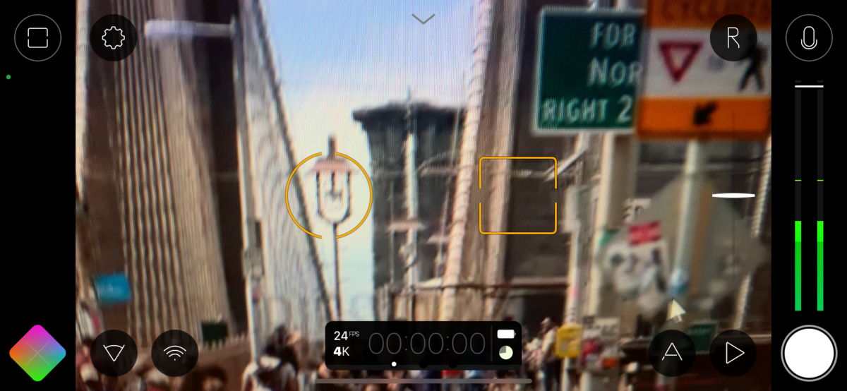 Screenshot of the Filmic Pro 7 video recording interface, showing controls over a blurred city scene.